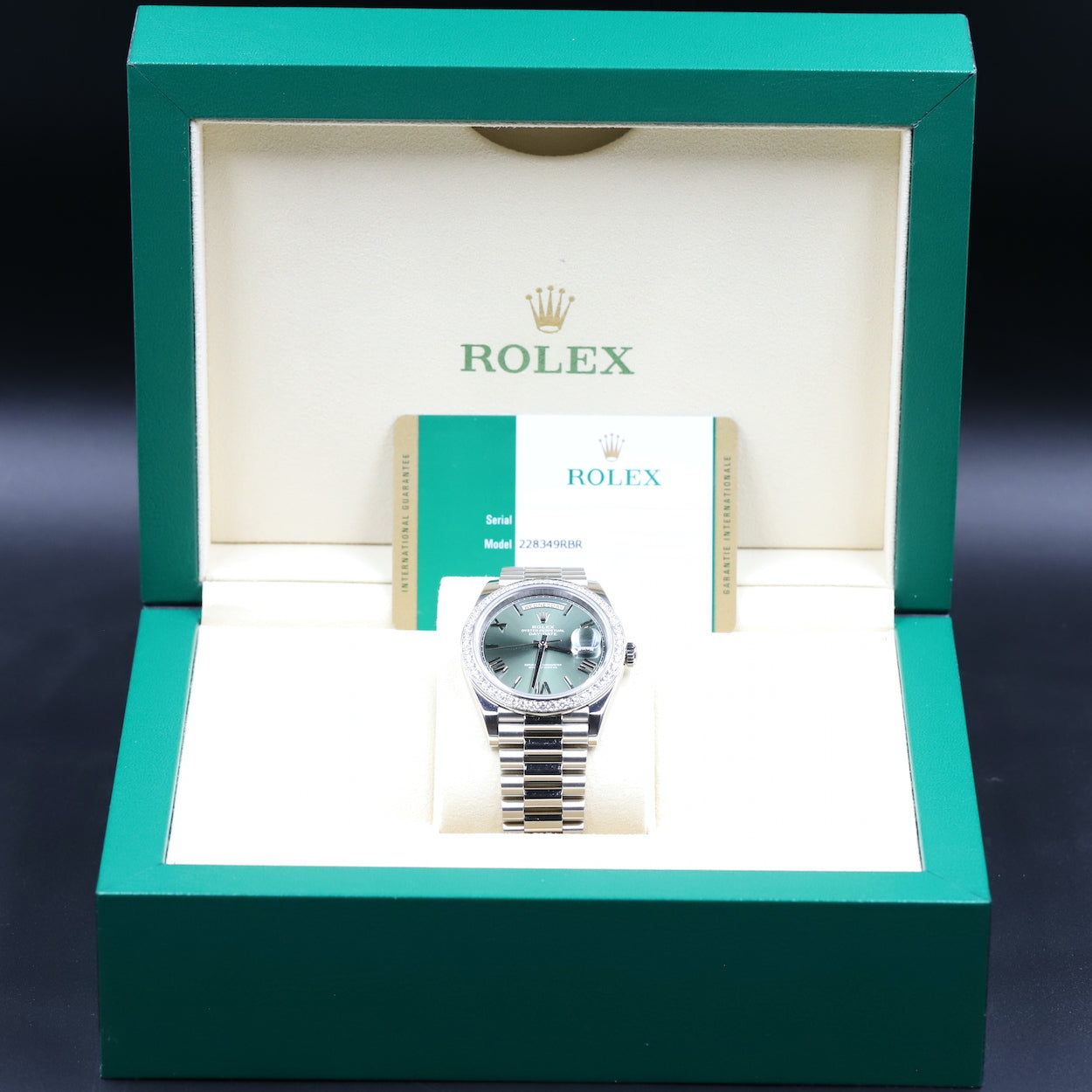 Rolex<br>228349RBR DayDate 40 White Gold Diamond Bezel Green Dial