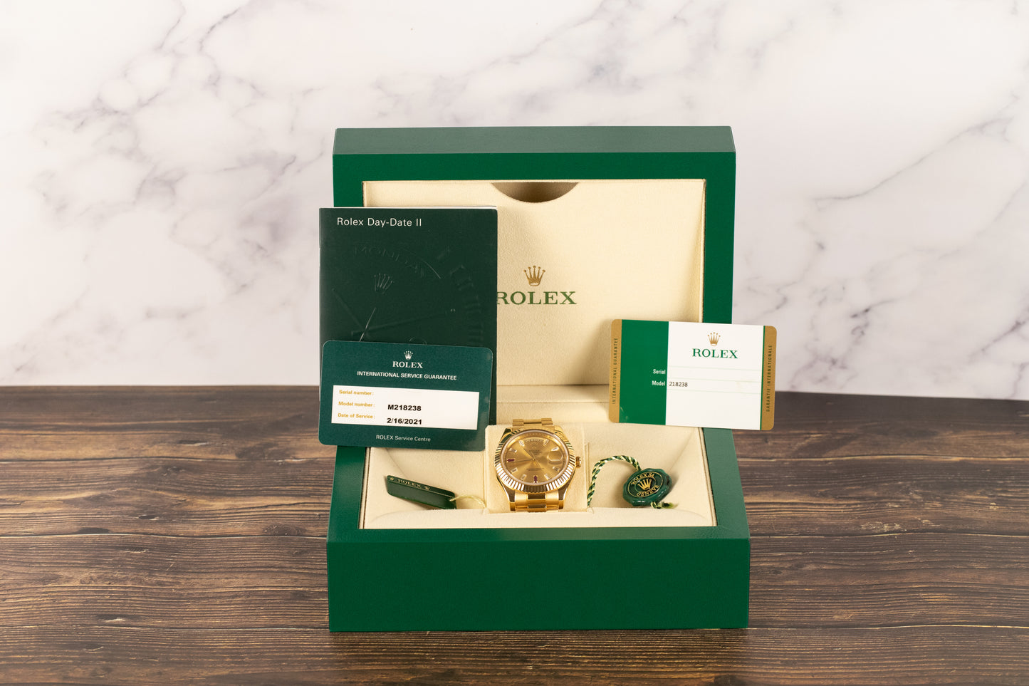 Rolex 218238 DayDate II Champagne Ruby Dial